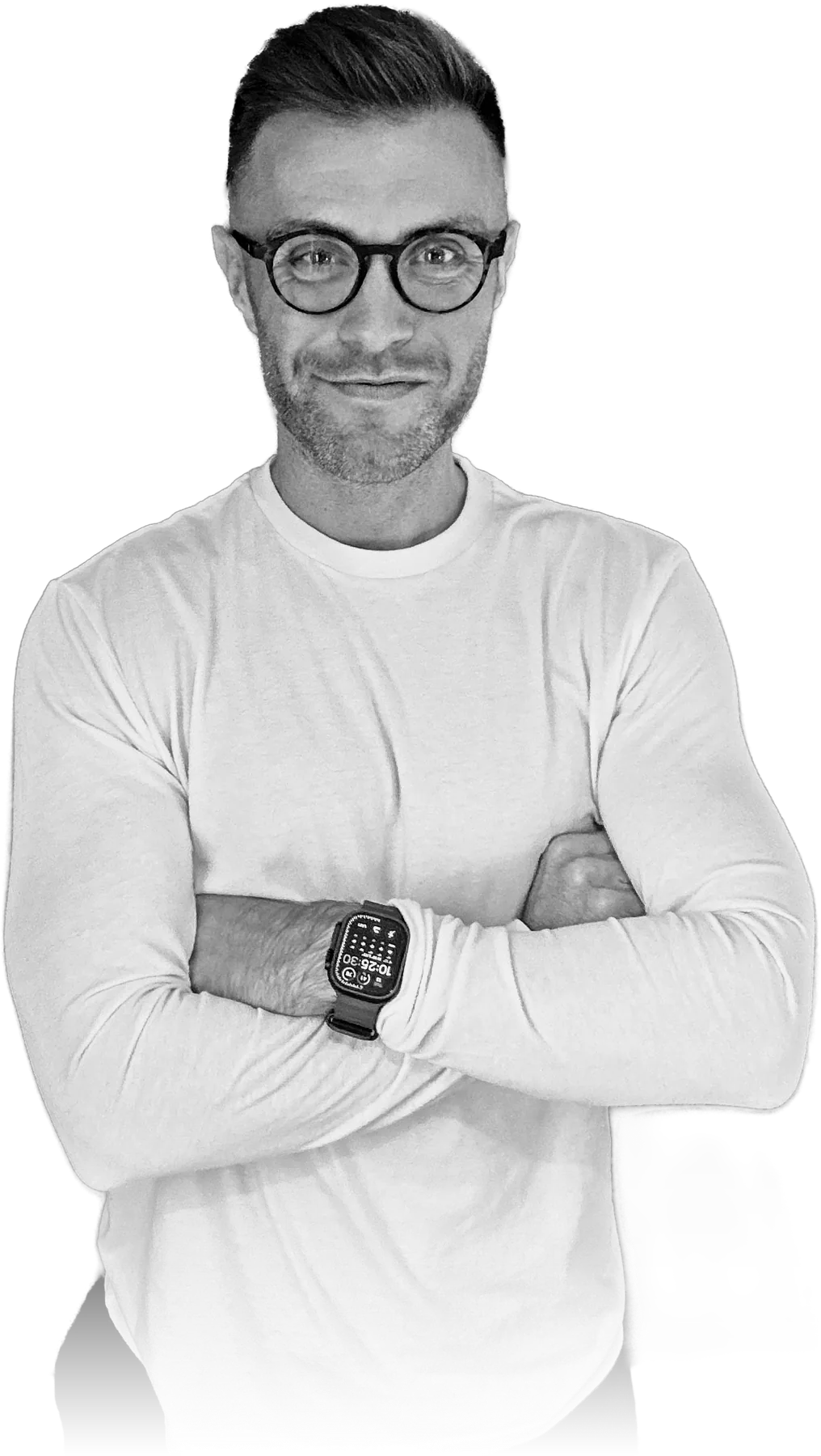 Ed Nieburg, arms folded, in a white long-sleeve top