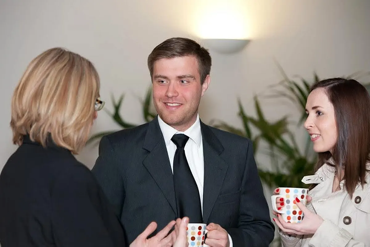 Ed talking with guests over coffee at the awards